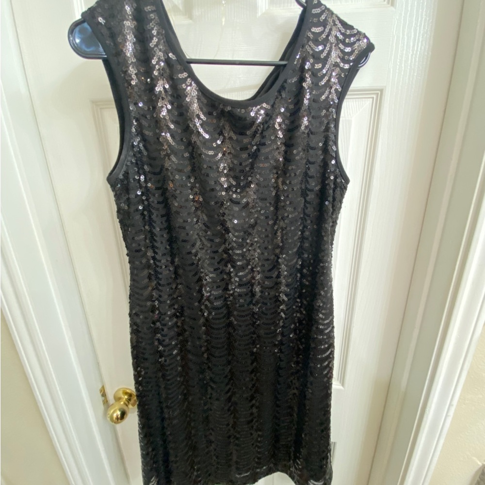 Black party dress. Shiny metallic finish. Short length. Size 12. - Picture 4 of 4